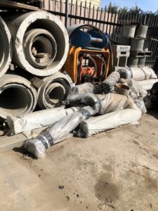 Improper disposal of asbestos pipe, we moved in and with help of remediation company secured and cleaned the area disposing of pipe in legal landfill ,